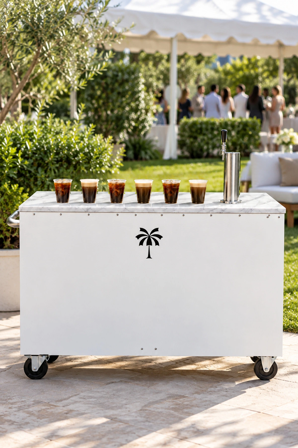 The Mabu iced coffee cart with cups of cold brew set out at an outdoor event